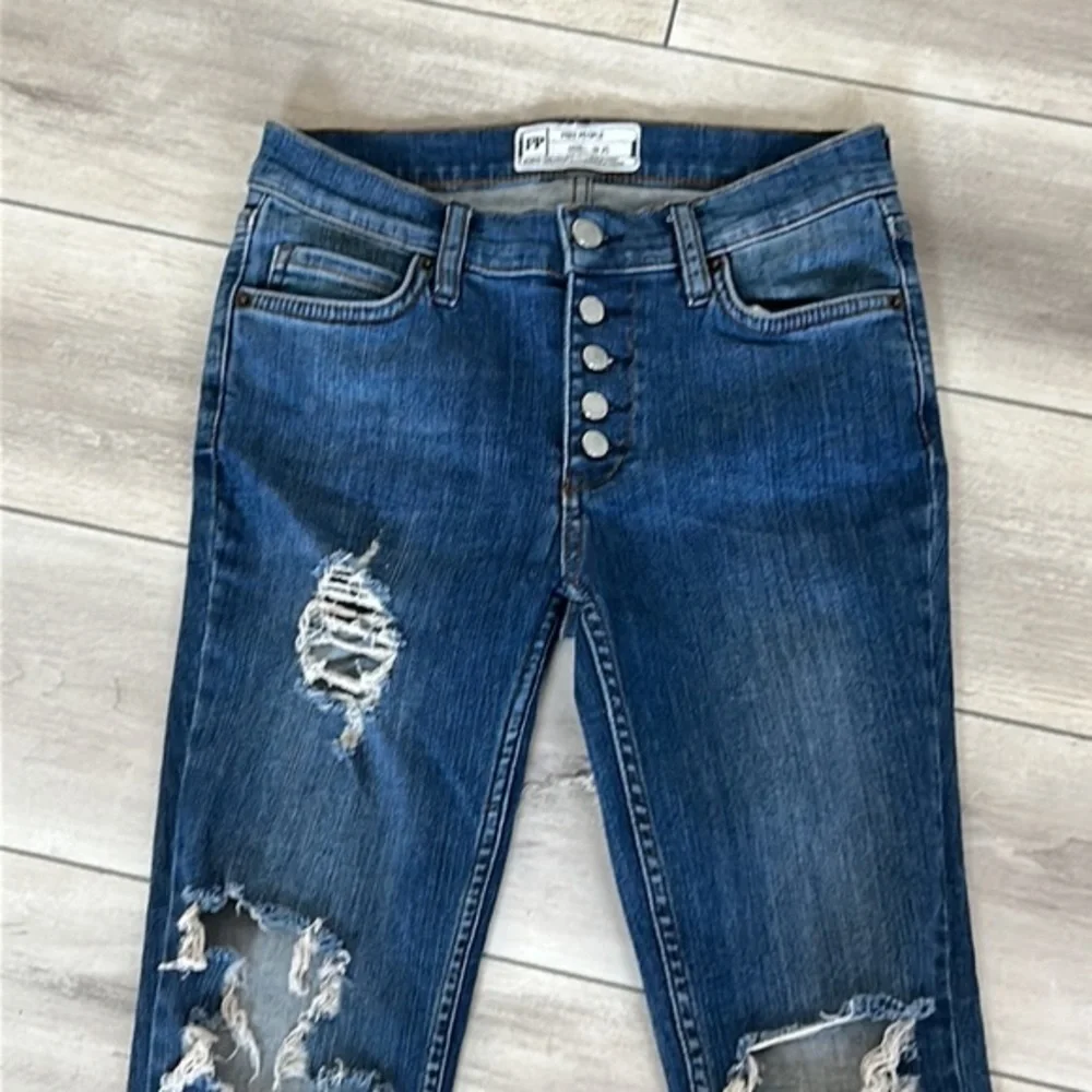 Free People size 25 busted knee button fly jeans